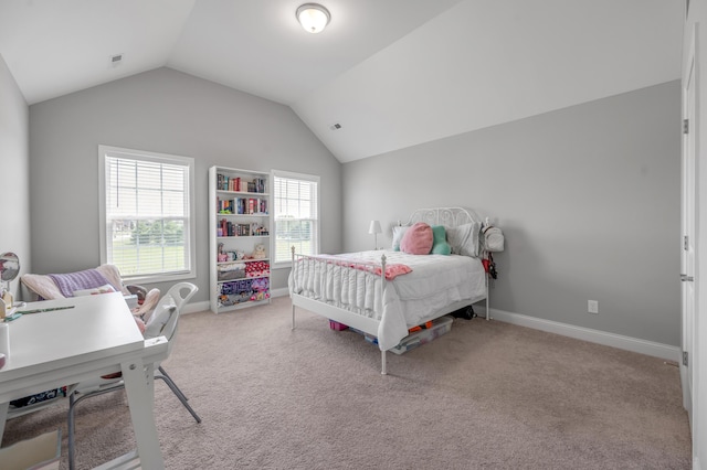 bedroom with vaulted ceiling and light carpet