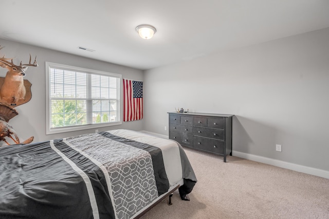 bedroom with light carpet