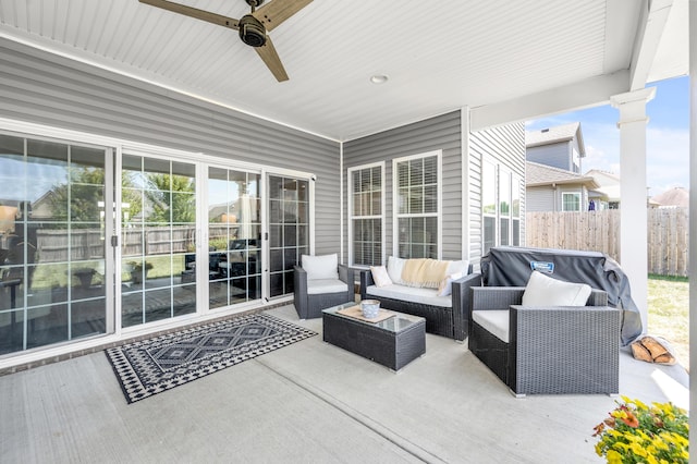 view of patio / terrace with ceiling fan and an outdoor living space