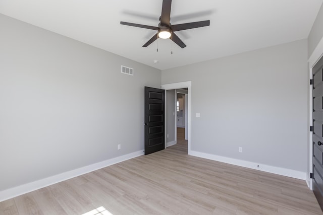unfurnished bedroom featuring visible vents, baseboards, and light wood-type flooring