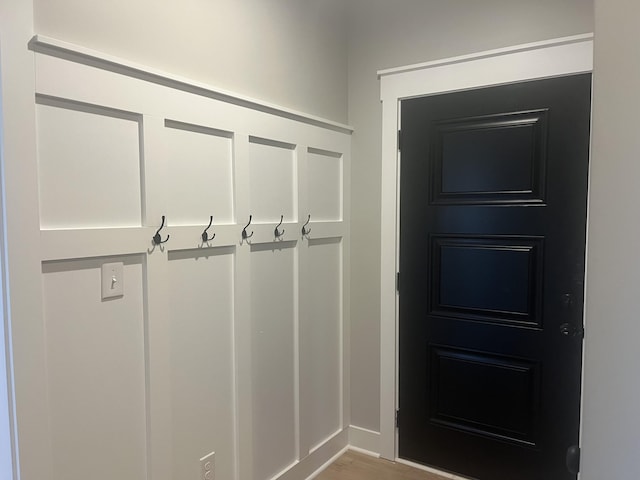 mudroom with wood finished floors