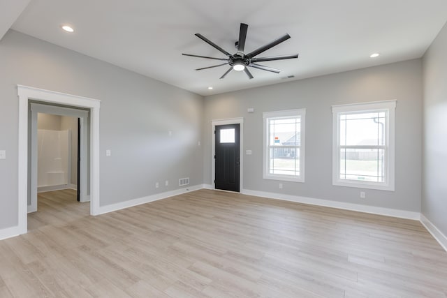 foyer featuring baseboards, visible vents, light wood-type flooring, and a ceiling fan