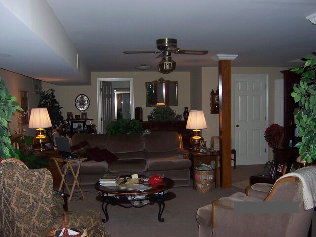 living room with carpet floors and ceiling fan