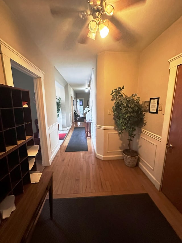 corridor featuring hardwood / wood-style floors