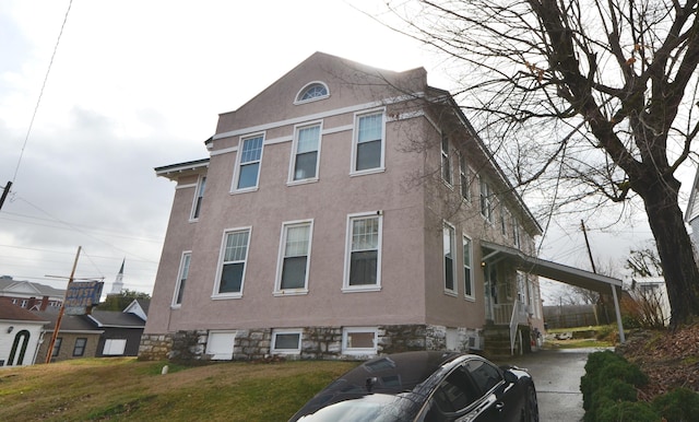 view of side of home featuring a yard