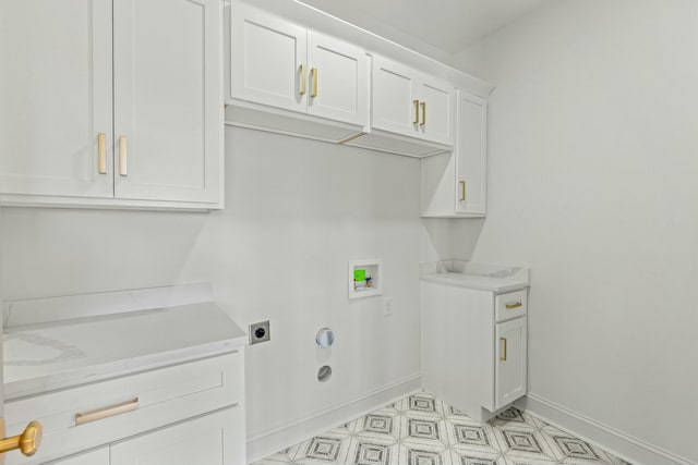 laundry room featuring washer hookup, hookup for a gas dryer, cabinets, and hookup for an electric dryer