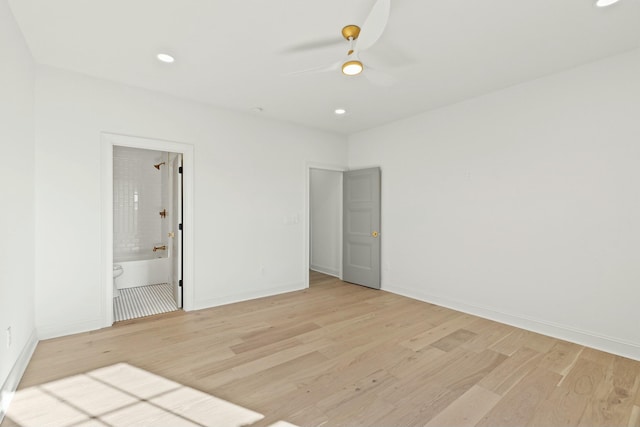 empty room with ceiling fan and light wood-type flooring