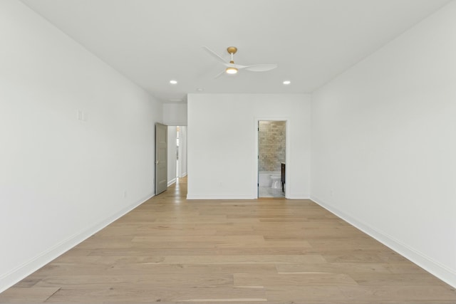 spare room with ceiling fan and light hardwood / wood-style flooring