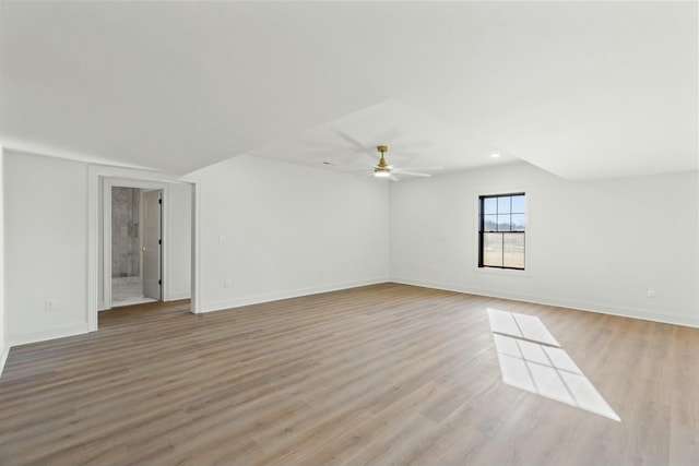 empty room featuring ceiling fan and light hardwood / wood-style floors