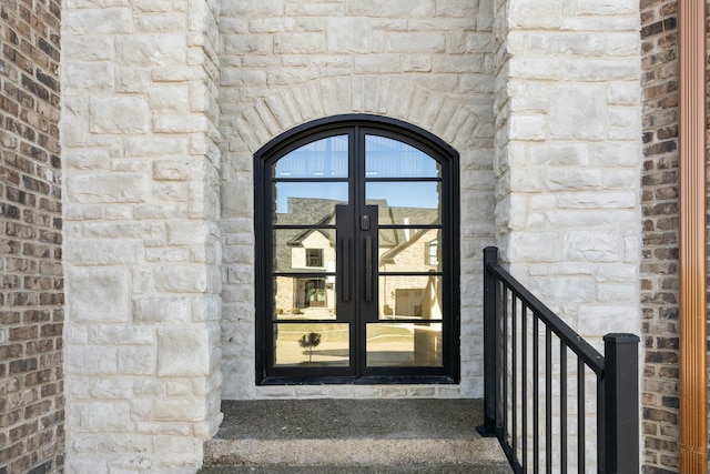 entrance to property featuring french doors