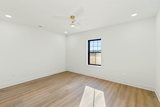 spare room with ceiling fan and light hardwood / wood-style floors