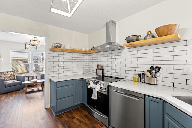 kitchen with dark wood-type flooring, island exhaust hood, stainless steel appliances, and blue cabinets