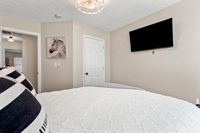 bedroom featuring a textured ceiling