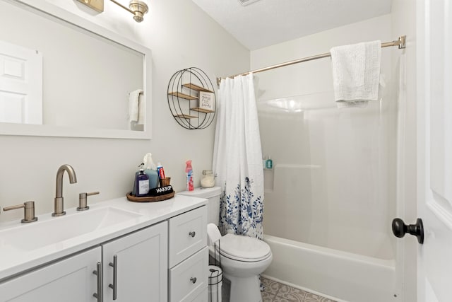 full bathroom with vanity, a textured ceiling, shower / bath combo with shower curtain, and toilet