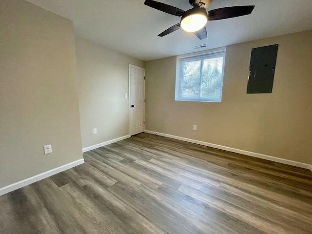 spare room with wood-type flooring and electric panel