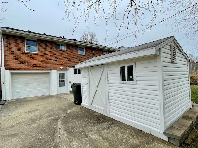 rear view of house with a garage