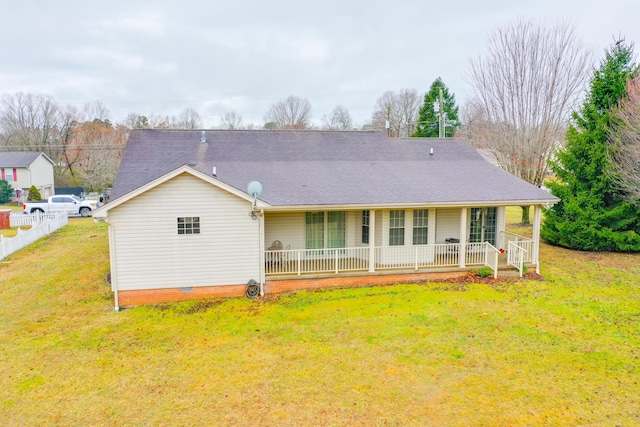 back of house featuring a porch and a yard