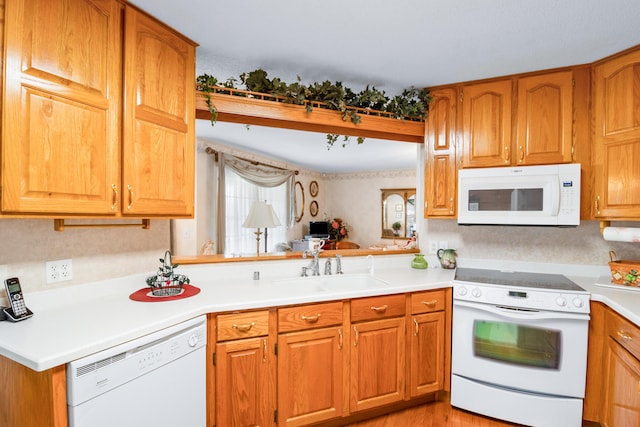 kitchen with sink and white appliances