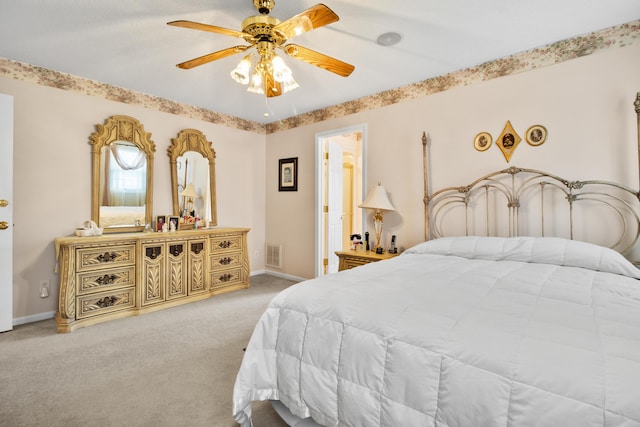 bedroom featuring ceiling fan and light colored carpet