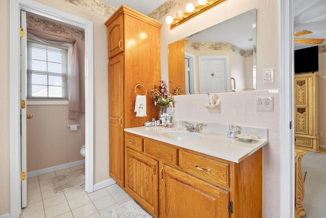 bathroom with vanity, tile patterned floors, and toilet