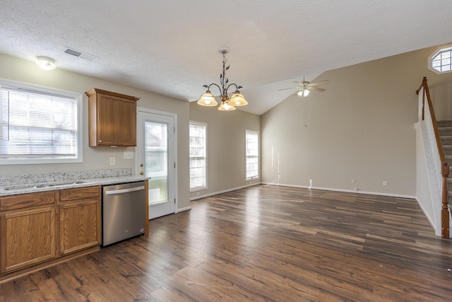 kitchen with dark wood-type flooring, lofted ceiling, dishwasher, and a wealth of natural light