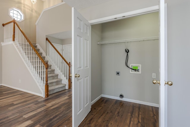 clothes washing area featuring dark hardwood / wood-style floors, washer hookup, and hookup for an electric dryer