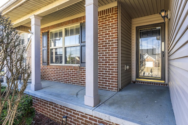 entrance to property featuring covered porch