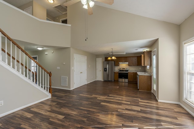 kitchen featuring pendant lighting, dark hardwood / wood-style floors, ceiling fan, and appliances with stainless steel finishes