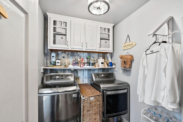 interior space featuring backsplash, separate washer and dryer, and white cabinets