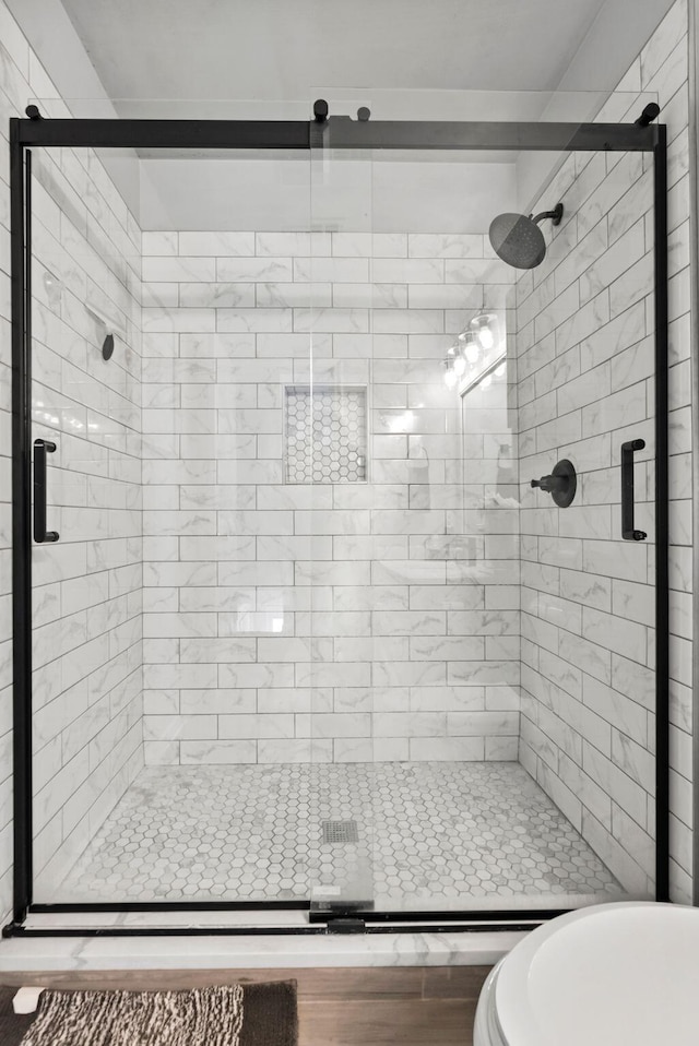 bathroom featuring an enclosed shower