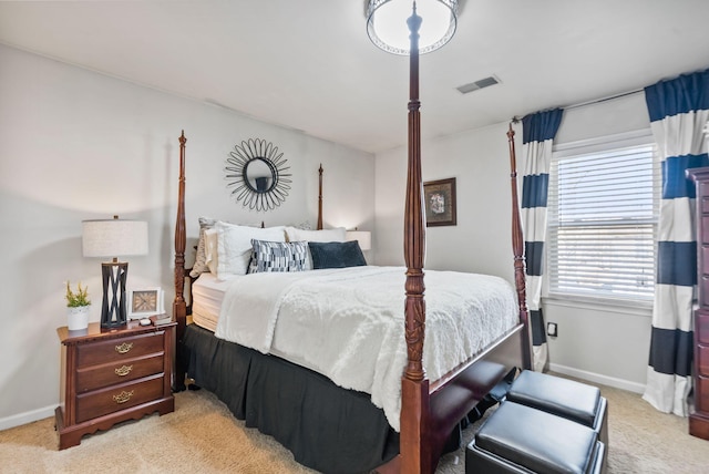 bedroom featuring light colored carpet