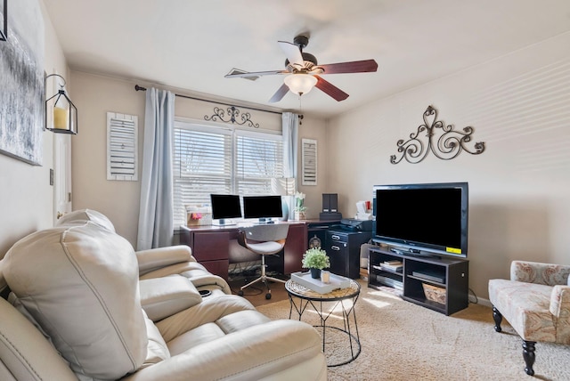 carpeted living room with ceiling fan