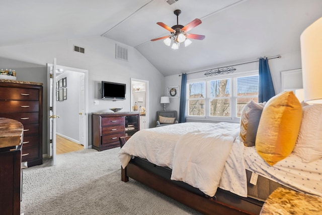 bedroom featuring lofted ceiling, light colored carpet, and ceiling fan