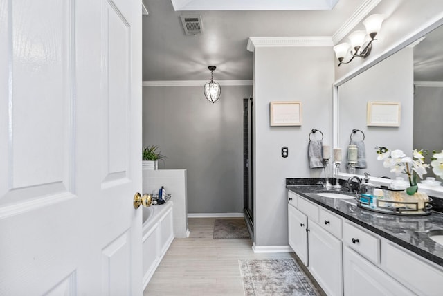 bathroom featuring vanity, separate shower and tub, and crown molding