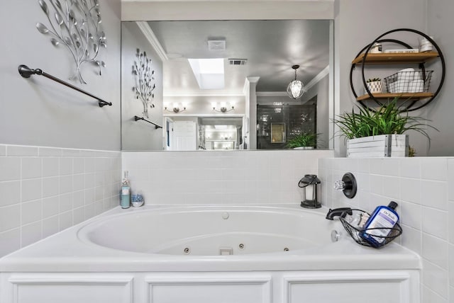 bathroom featuring crown molding, a bathtub, and a skylight