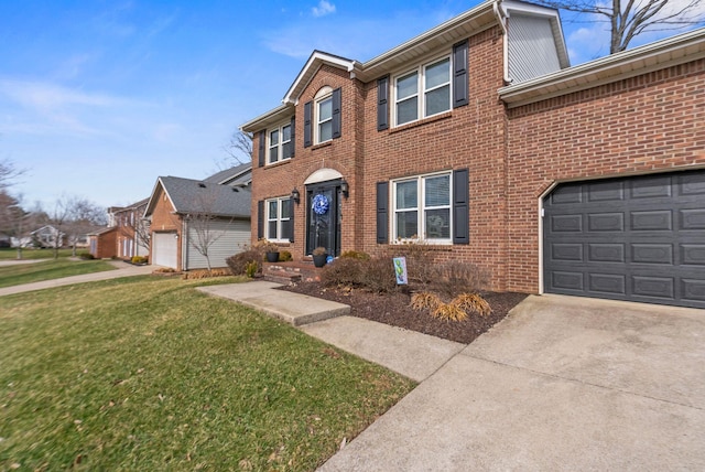 view of front of house featuring a garage and a front lawn