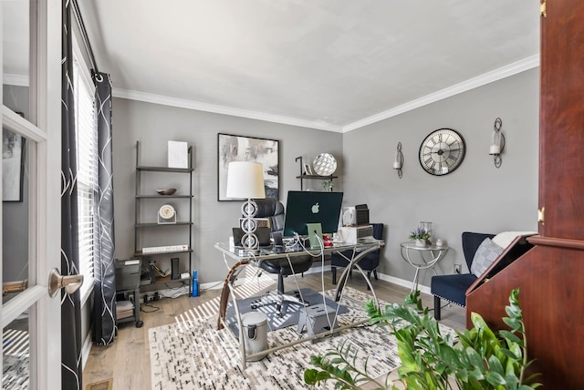 office space with crown molding and light wood-type flooring