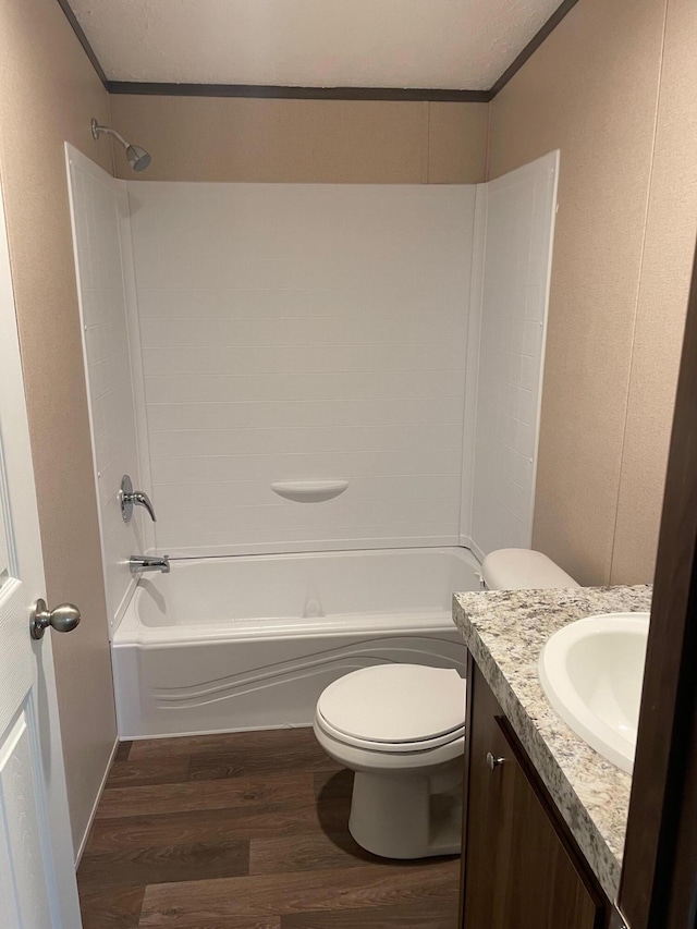 full bathroom featuring vanity, wood-type flooring, toilet, and shower / bath combination