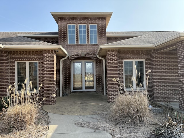 entrance to property with french doors and a patio area