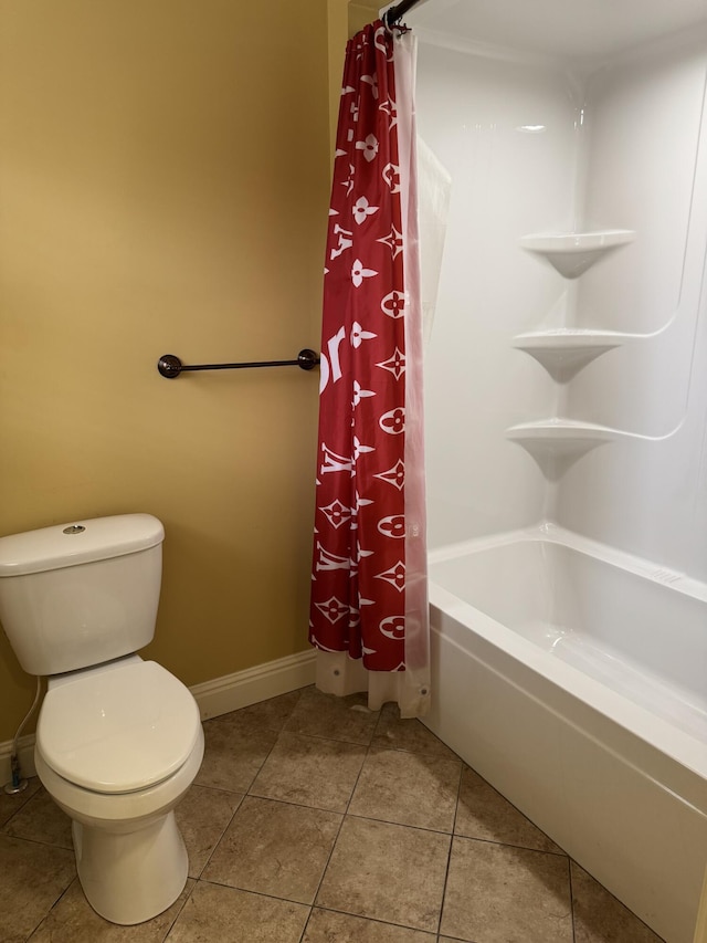 bathroom with toilet, tile patterned floors, and shower / bath combo with shower curtain