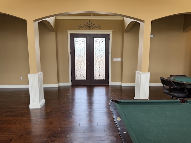 entryway featuring ornamental molding, dark hardwood / wood-style floors, pool table, and french doors