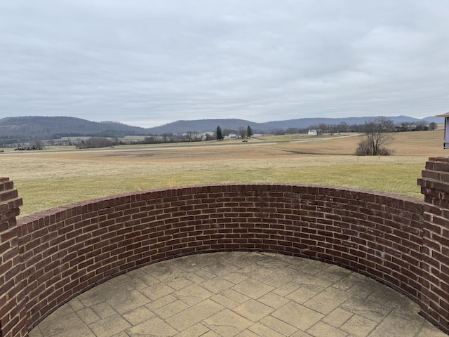 view of mountain feature with a rural view