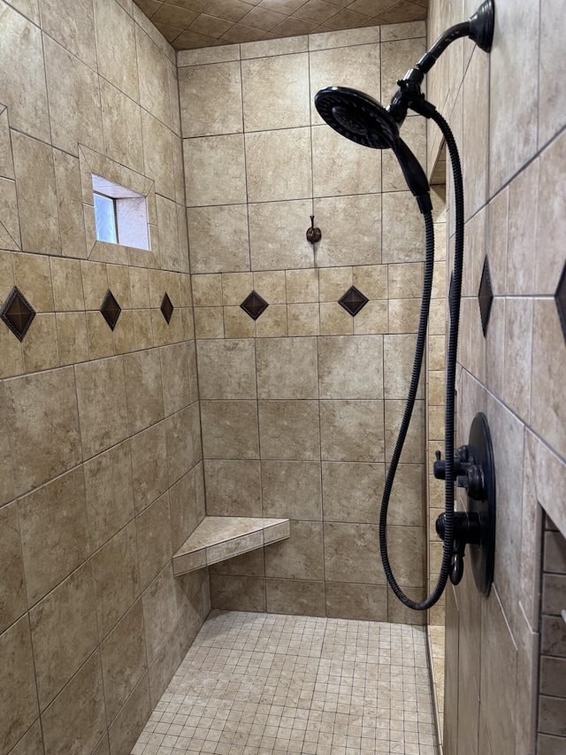 bathroom featuring tiled shower