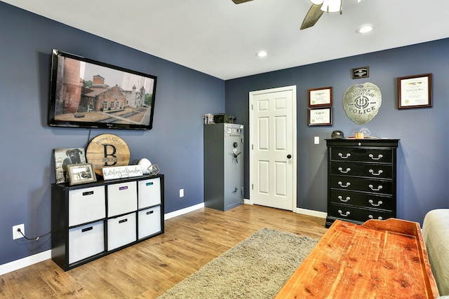 interior space with ceiling fan and light hardwood / wood-style flooring