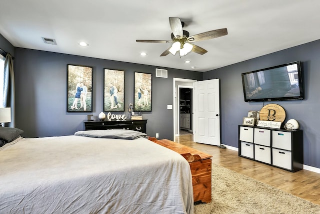 bedroom with ceiling fan and light hardwood / wood-style floors