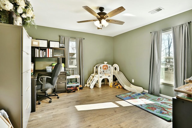 rec room featuring ceiling fan and light hardwood / wood-style flooring