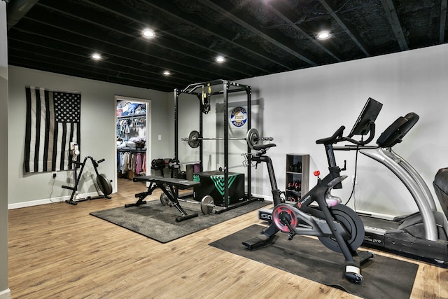 workout room featuring hardwood / wood-style floors