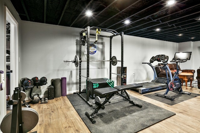 workout room with hardwood / wood-style flooring