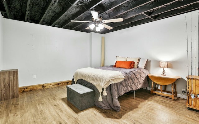 bedroom featuring ceiling fan and hardwood / wood-style floors