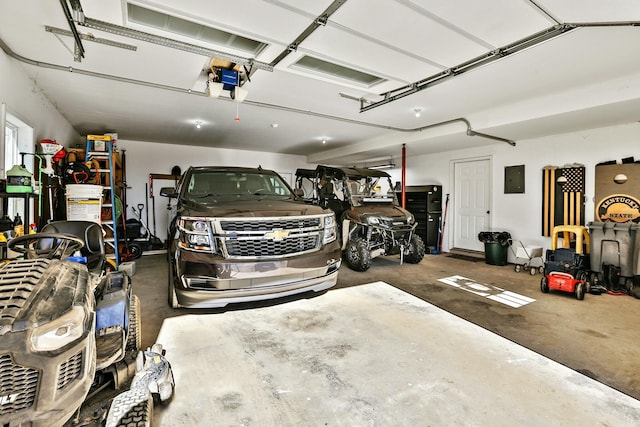 garage featuring a garage door opener and electric panel